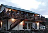 Photo of the private home with birders looking at eagles.